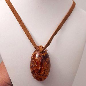 Large Amber Pendant on Leather Necklace. Please see photos for more details.